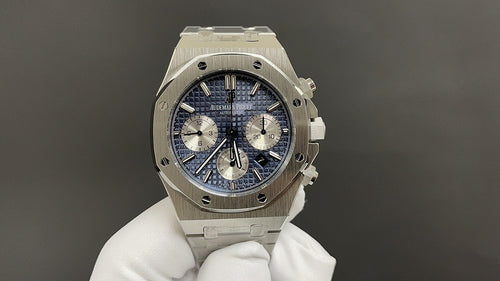 Audemars Piguet Royal Oak watch with blue dial, steel case, and chronograph subdials