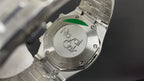 Audemars Piguet watch caseback with engraved logo and steel bracelet links