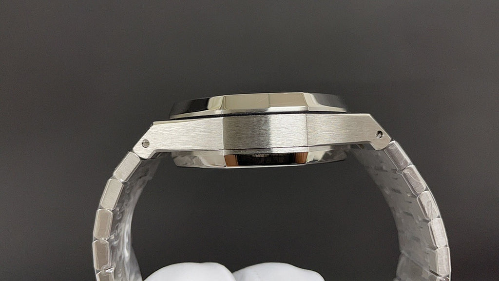 Audemars Piguet watch with brushed steel bezel and raised crown guards