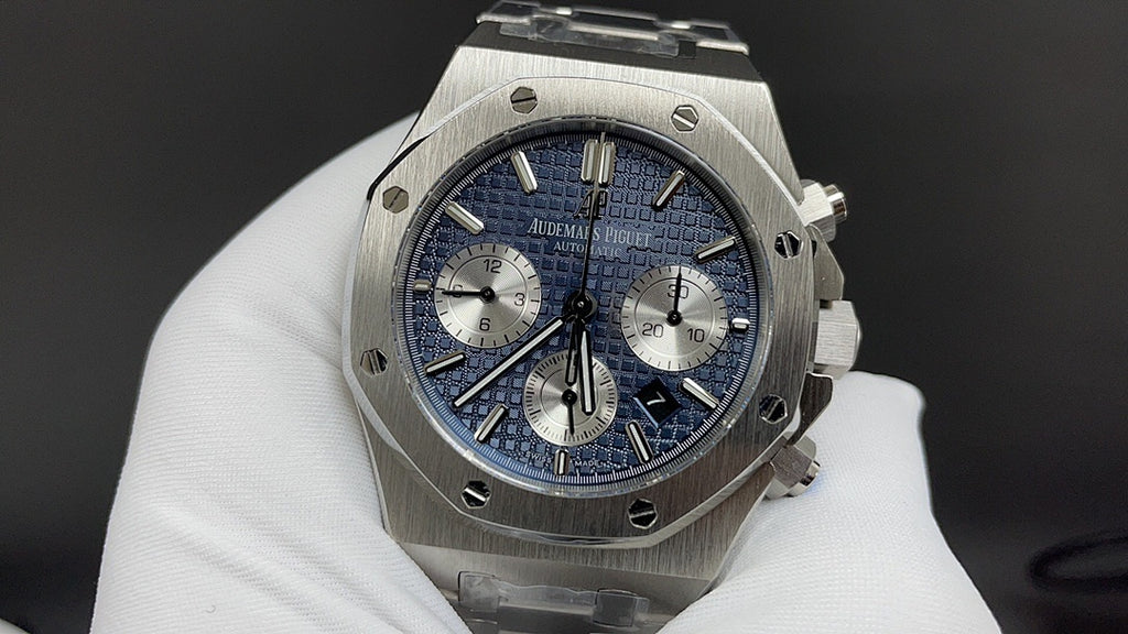 Audemars Piguet watch with blue dial, steel bracelet, and three chronograph subdials