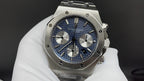 Audemars Piguet watch with blue dial, steel bracelet, and three chronograph subdials