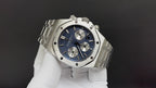 Audemars Piguet watch with blue dial and steel case, viewed at an angle