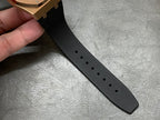 Black rubber watch strap with multiple adjustment holes