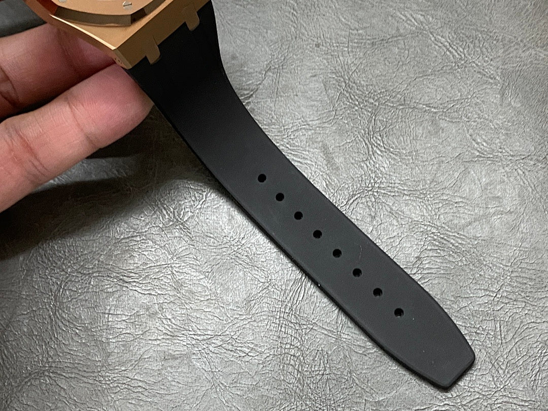 Black rubber watch strap with multiple adjustment holes