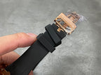Rose gold deployment clasp with black rubber strap