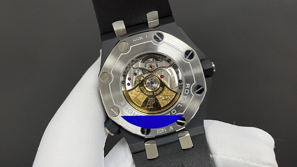 Audemars Piguet watch caseback with exposed mechanical movement on black strap