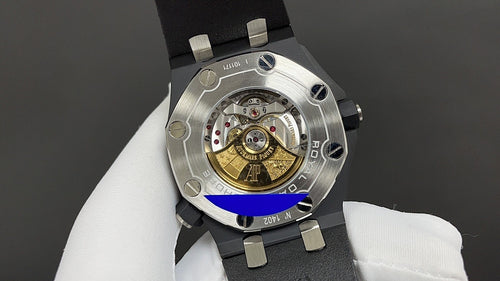 Audemars Piguet watch caseback with exposed mechanical movement on black strap