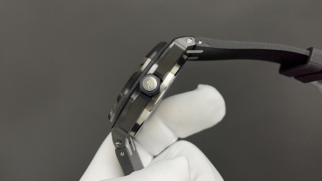 Audemars Piguet watch with silver case side and black rubber strap