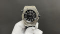 Audemars Piguet stainless steel watch with black dial and black rubber strap