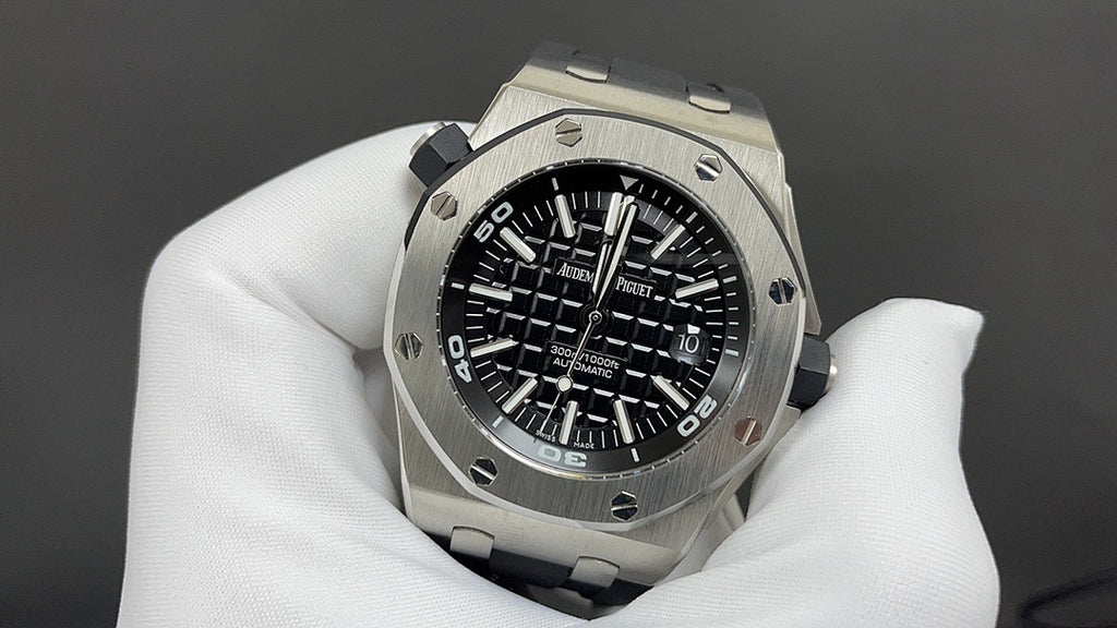 Stainless steel watch with black dial and chronograph markings, on black strap
