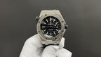 Stainless steel diver watch with black dial and black rubber strap