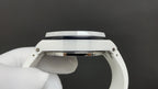 Audemars Piguet watch top view with white bezel and case, metallic crown section.