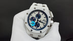 Audemars Piguet watch front view, white case and strap, blue dial with subdials.