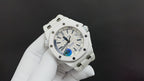 Audemars Piguet watch with white dial, blue accents, and white rubber strap