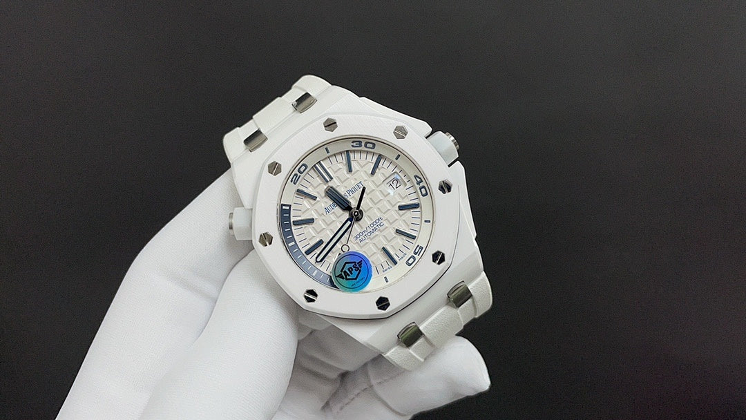 Audemars Piguet watch with white dial, blue accents, and white rubber strap
