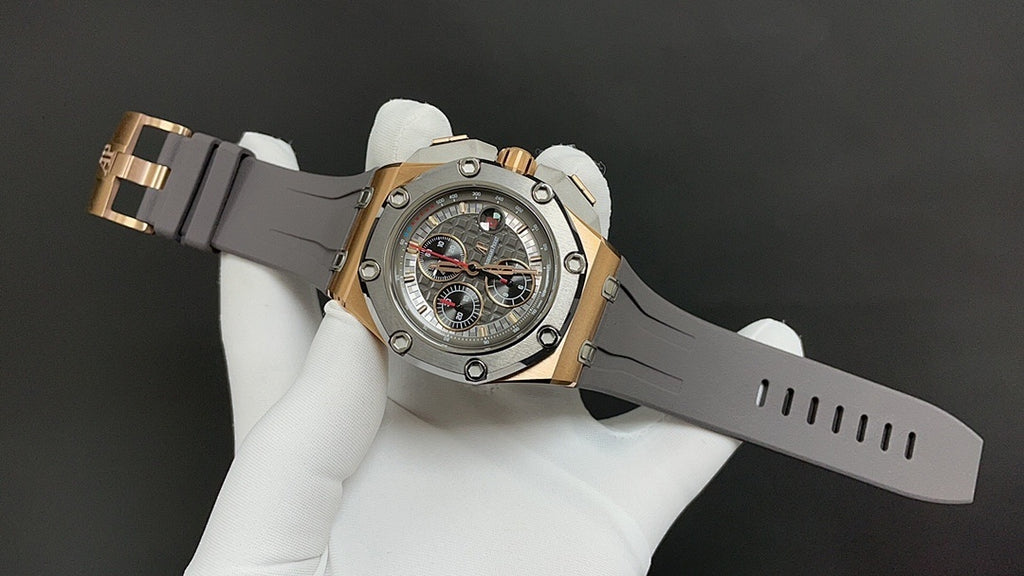 Luxury chronograph watch on dark gray rubber strap with metal clasp