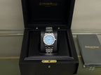 Audemars Piguet watch in presentation box with blue dial and stainless steel bracelet
