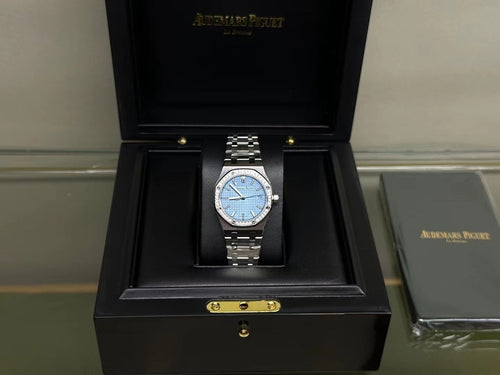 Audemars Piguet watch in presentation box with blue dial and stainless steel bracelet
