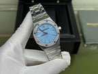 Audemars Piguet watch close-up front with blue dial and gem-set bezel