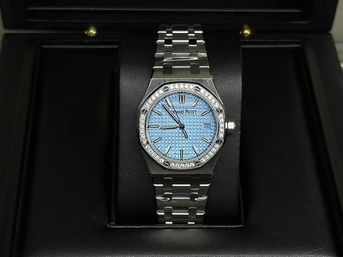 Audemars Piguet watch: blue dial, gem-set bezel, stainless steel bracelet