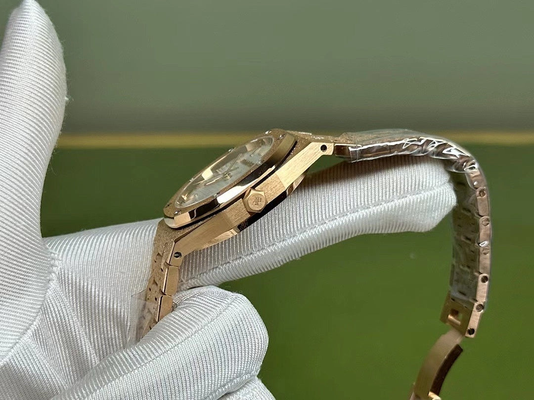Gold-tone Audemars Piguet watch with side profile and metal bracelet links