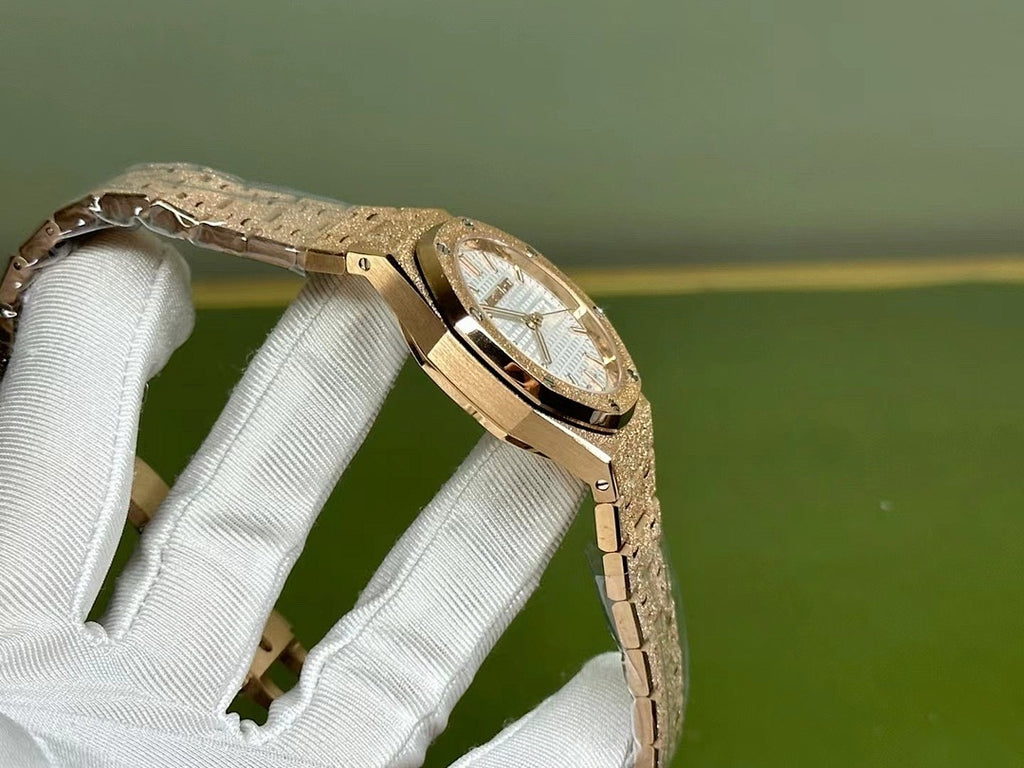 Gold-tone Audemars Piguet watch with curved case and bracelet, side angle view