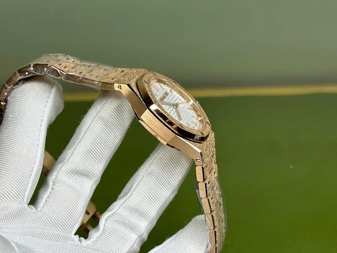 Gold-tone Audemars Piguet watch with curved case and bracelet, side angle view