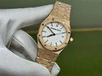 Gold-tone Audemars Piguet wristwatch with white dial and black hands, date window visible