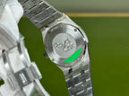 Audemars Piguet Royal Oak watch caseback close-up with emblem on steel bracelet