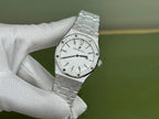 Audemars Piguet Royal Oak watch with silver dial, visible hands and markers on steel bracelet