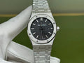 Audemars Piguet stainless steel wristwatch with black textured dial and metal bracelet