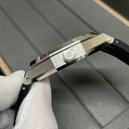 Audemars Piguet watch side view with brushed metal case and black rubber strap