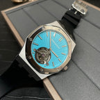 Audemars Piguet watch with blue dial, metal case, and black rubber strap