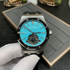 Audemars Piguet watch with cyan-blue dial, metal bezel, and black rubber strap