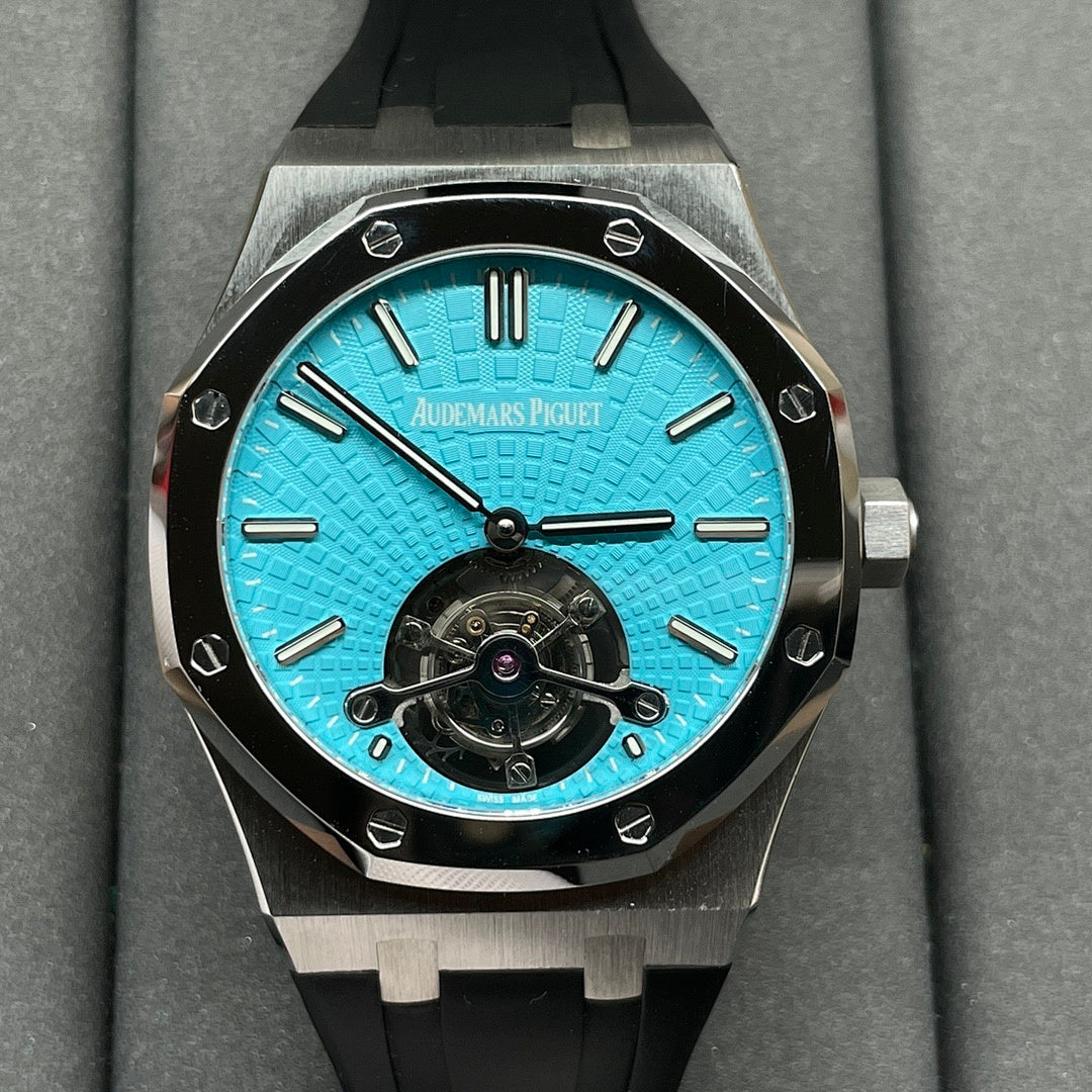 Audemars Piguet watch with blue textured dial, black bezel, and black rubber strap