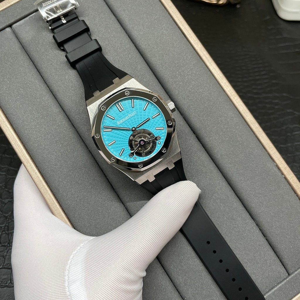 Audemars Piguet watch with blue textured dial, black bezel, and black rubber strap