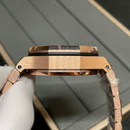 Rose-gold watch case top view with open bezel and integrated bracelet links