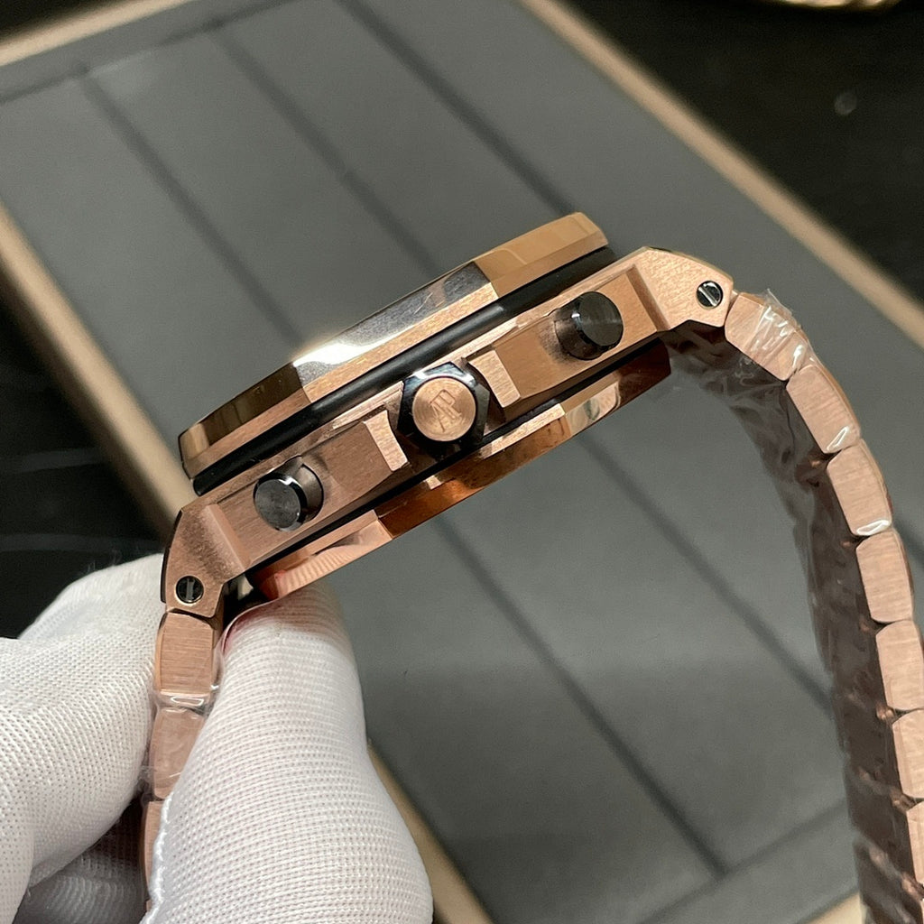 Rose-gold watch side view with crown and pushers, metal bracelet links
