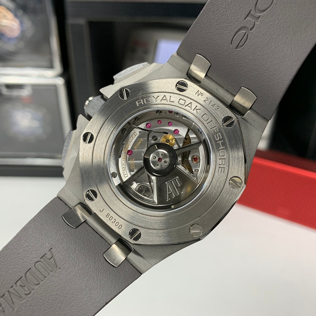 Watch caseback close-up showing mechanical movement through clear window