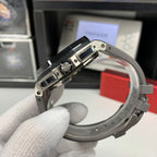 Watch bezel close-up from the side with gray strap and exposed inner case