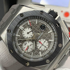 Close-up of chronograph dial with three subdials and dark textured finish