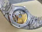 Automatic watch with see-through caseback, gold-toned rotor, and stainless bracelet