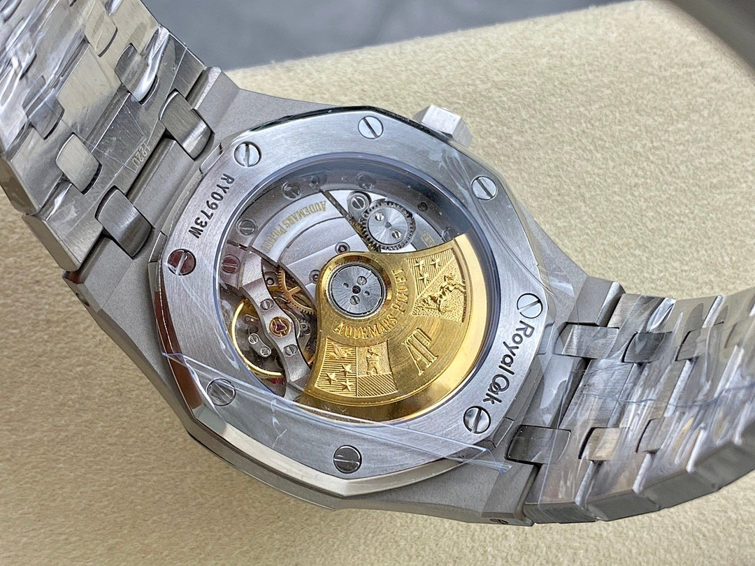 Automatic watch with see-through caseback, gold-toned rotor, and stainless bracelet