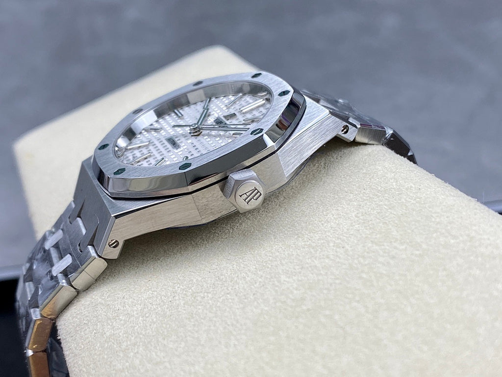 Automatic stainless-steel watch with crown, silver dial, and metal bracelet