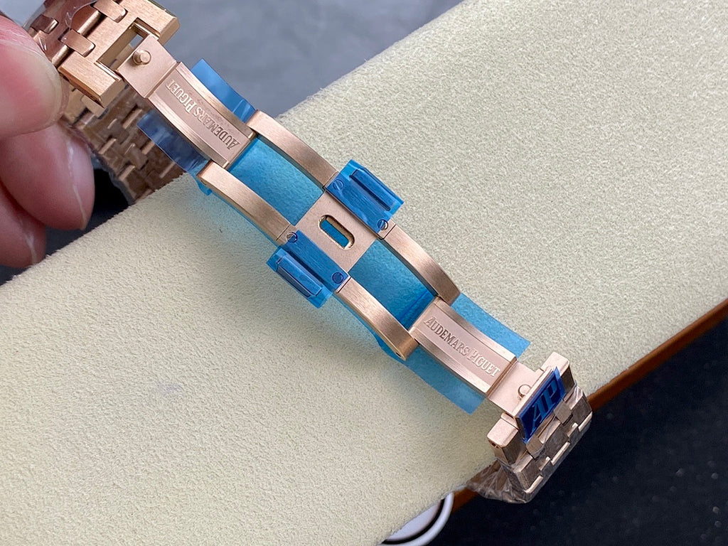 Audemars Piguet watch bracelet close-up with blue clasp and rose-gold links