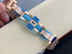 Audemars Piguet watch bracelet close-up with blue clasp and rose-gold links