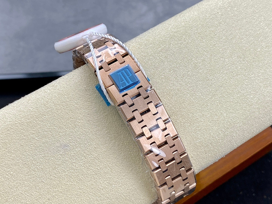 Audemars Piguet watch clasp close-up with rose-gold tone links and blue insert