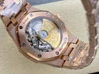 Audemars Piguet watch caseback with visible mechanical movement and gold-tone details