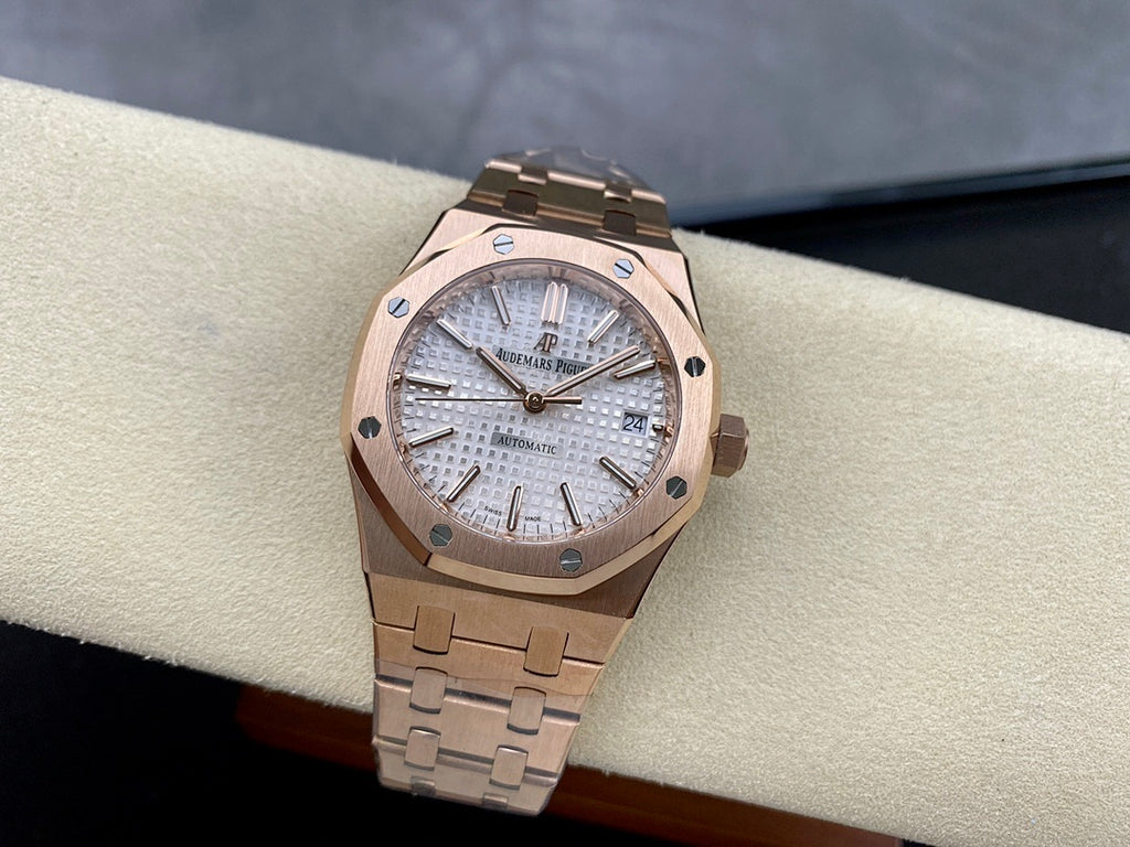 Audemars Piguet automatic watch on display pillow with silver dial and rose-gold bracelet