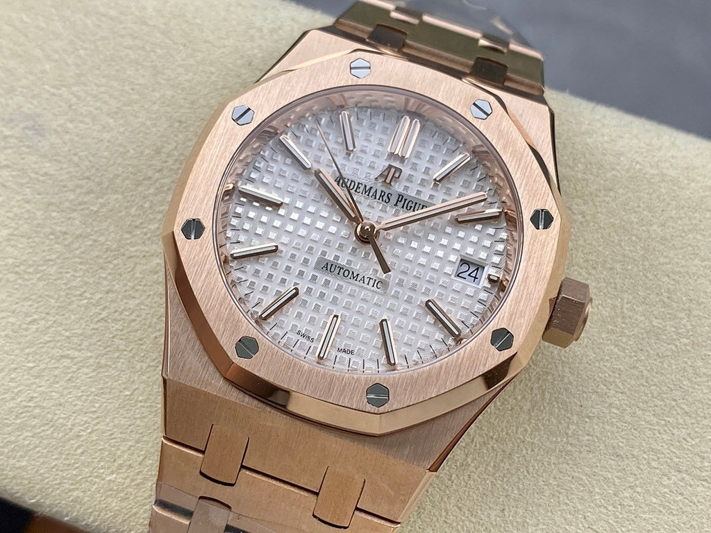 Audemars Piguet automatic watch with rose-gold tone bracelet and textured silver dial
